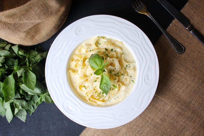Creamy Fettuccine Alfredo with pan-seared chicken and herbs