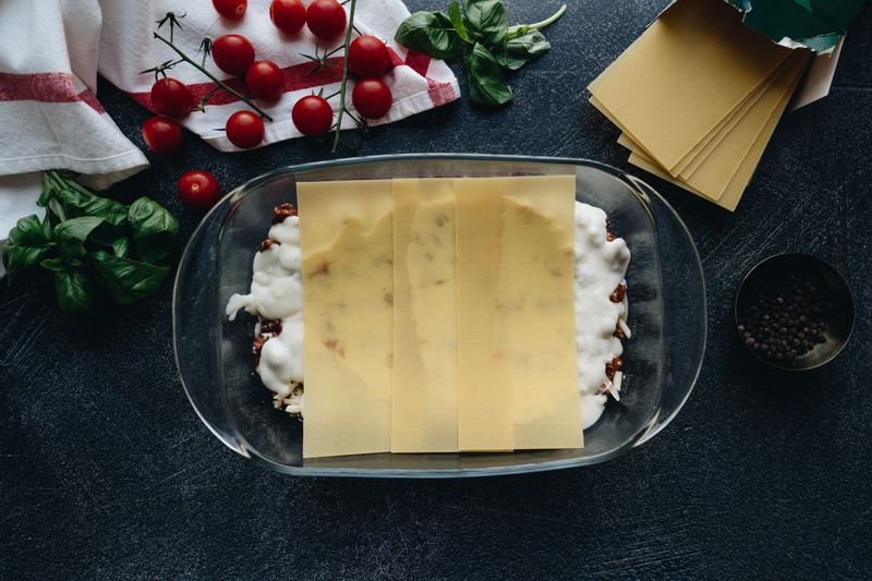 Oven-baked lasagna with ricotta, béchamel and meat sauce layers