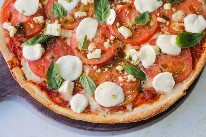 Classic Margherita marco's pizza with fresh basil and mozzarella